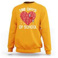 Gold crewneck sweatshirt with “100 DAYS OF SCHOOL” alphabet graphic on front