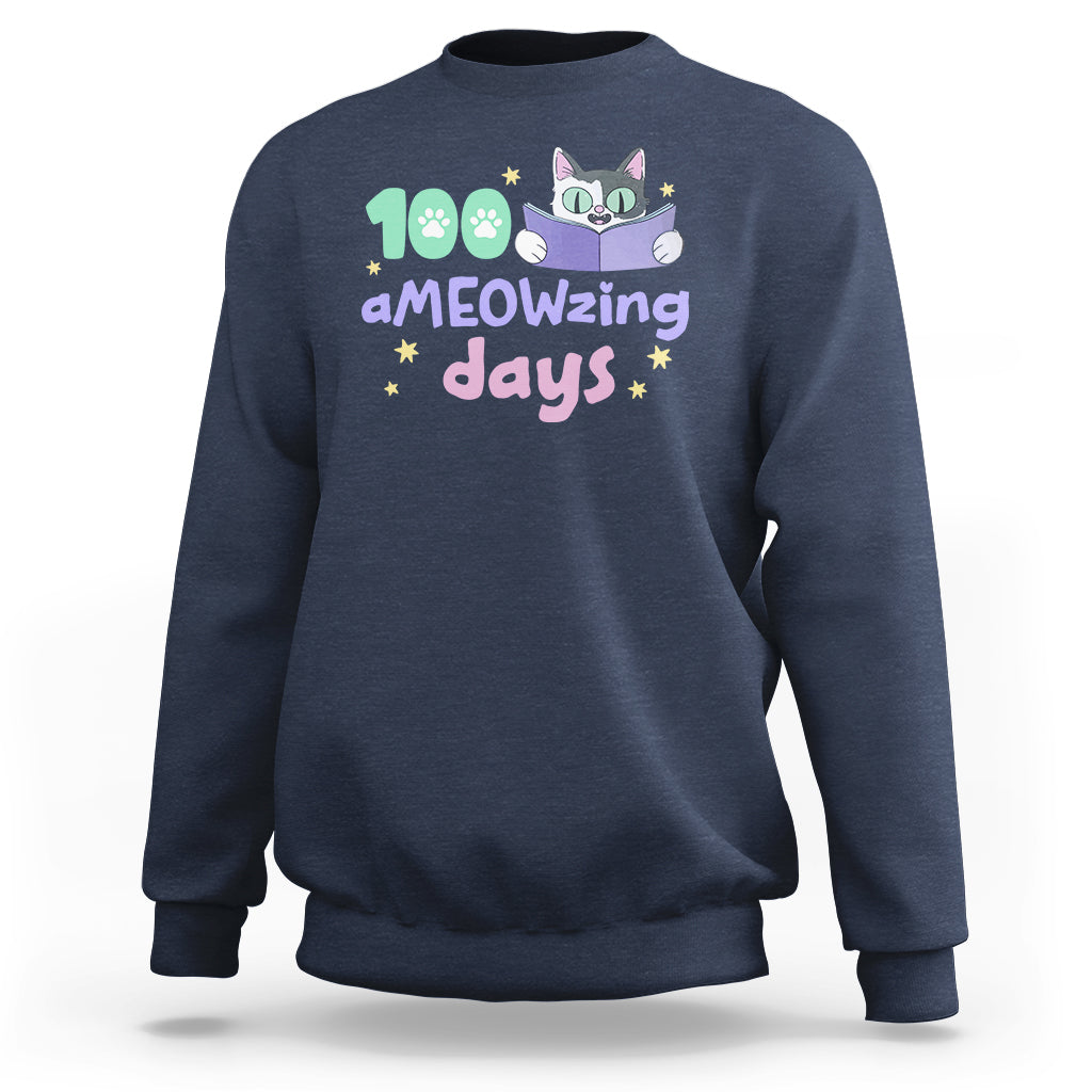 Navy sweatshirt with "aMEOWzing days" cat reading book graphic