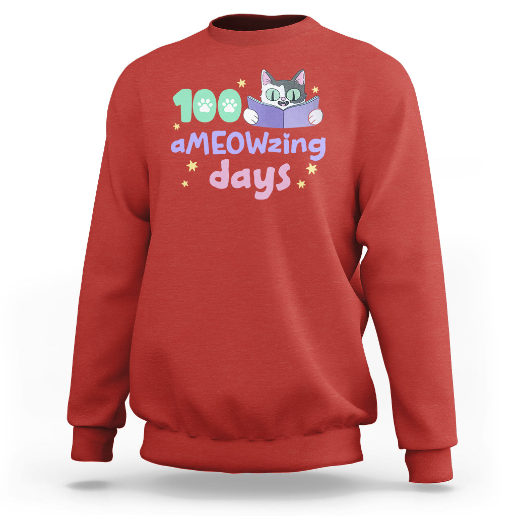 Red sweatshirt with "aMEOWzing days" cat reading book graphic