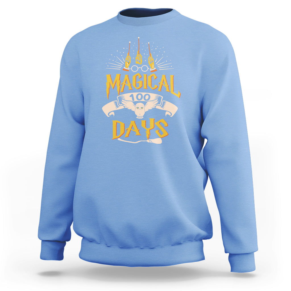 Carolina blue crewneck sweatshirt with colorful “Magic Owl” school graphic on the back.