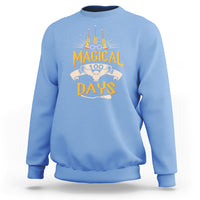 Carolina blue crewneck sweatshirt with colorful “Magic Owl” school graphic on the back.