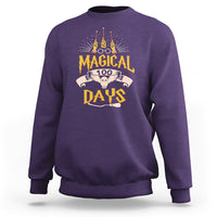 Purple crewneck sweatshirt with colorful “Magic Owl” school graphic on the back.