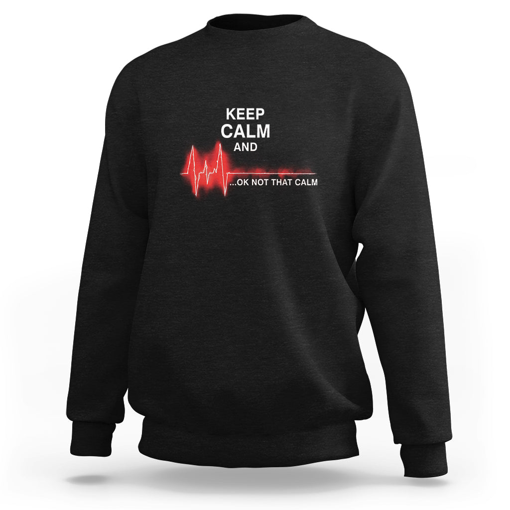 Black nurse sweatshirt with “KEEP CALM AND …OK NOT THAT CALM” graphic and red heartbeat
