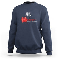 Navy nurse sweatshirt with “KEEP CALM AND …OK NOT THAT CALM” graphic and red heartbeat