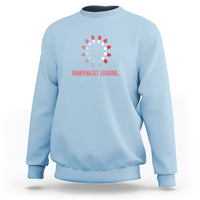 Light blue sweatshirt with pharmacist-themed loading graphic and red text on chest