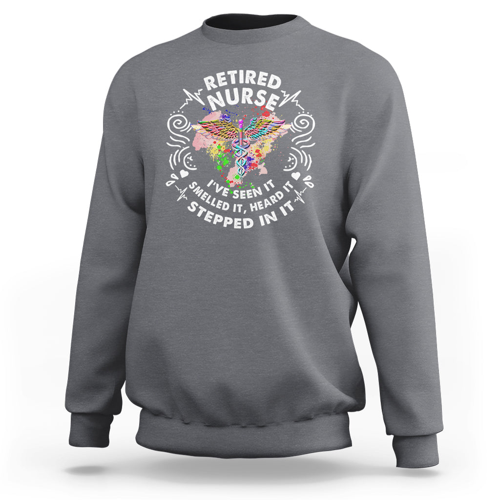 Charcoal gray retired nurse crewneck sweatshirt with colorful nurse graphic and text
