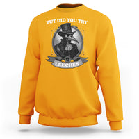 Gold plague doctor sweatshirt with 'BUT DID YOU TRY' leeches chest graphic