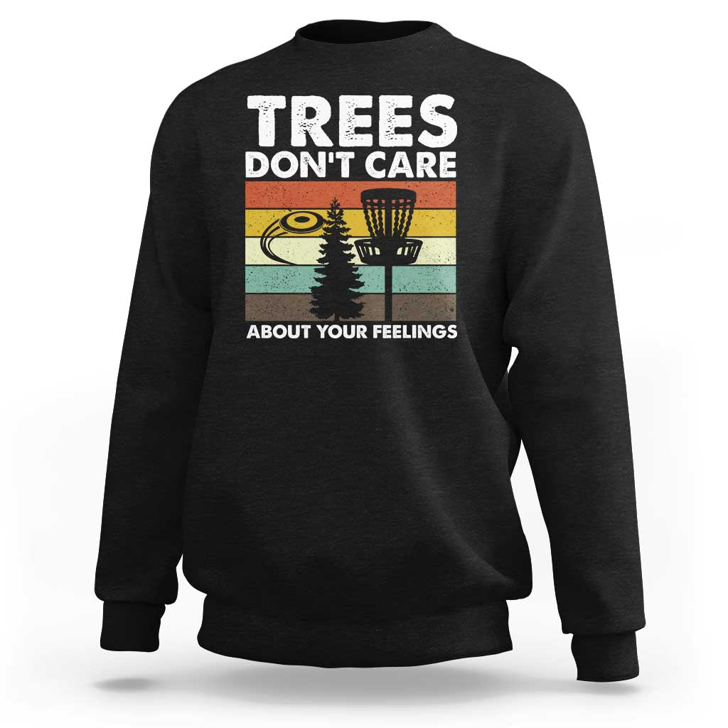 Black crewneck sweatshirt with “Trees don’t care” graphic and trees scene.
