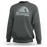 Charcoal crewneck sweatshirt with “My Retirement Plan” golfer graphic on chest