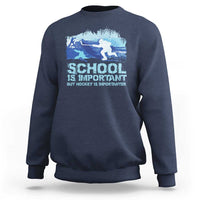 Navy crewneck sweatshirt with blue hockey graphic and “School is Important” text.