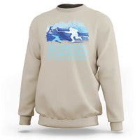 Sand crewneck sweatshirt with blue hockey graphic and “School is Important” text.