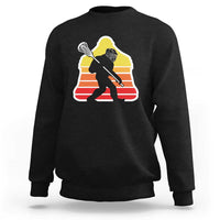 Black crewneck sweatshirt with Bigfoot lacrosse player graphic on chest