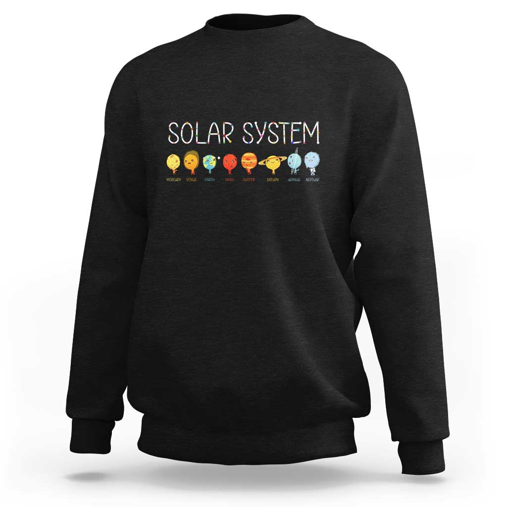 Black crewneck sweatshirt with “SOLAR SYSTEM” graphic and planet icons on back