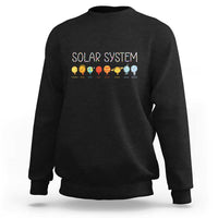 Black crewneck sweatshirt with “SOLAR SYSTEM” graphic and planet icons on back