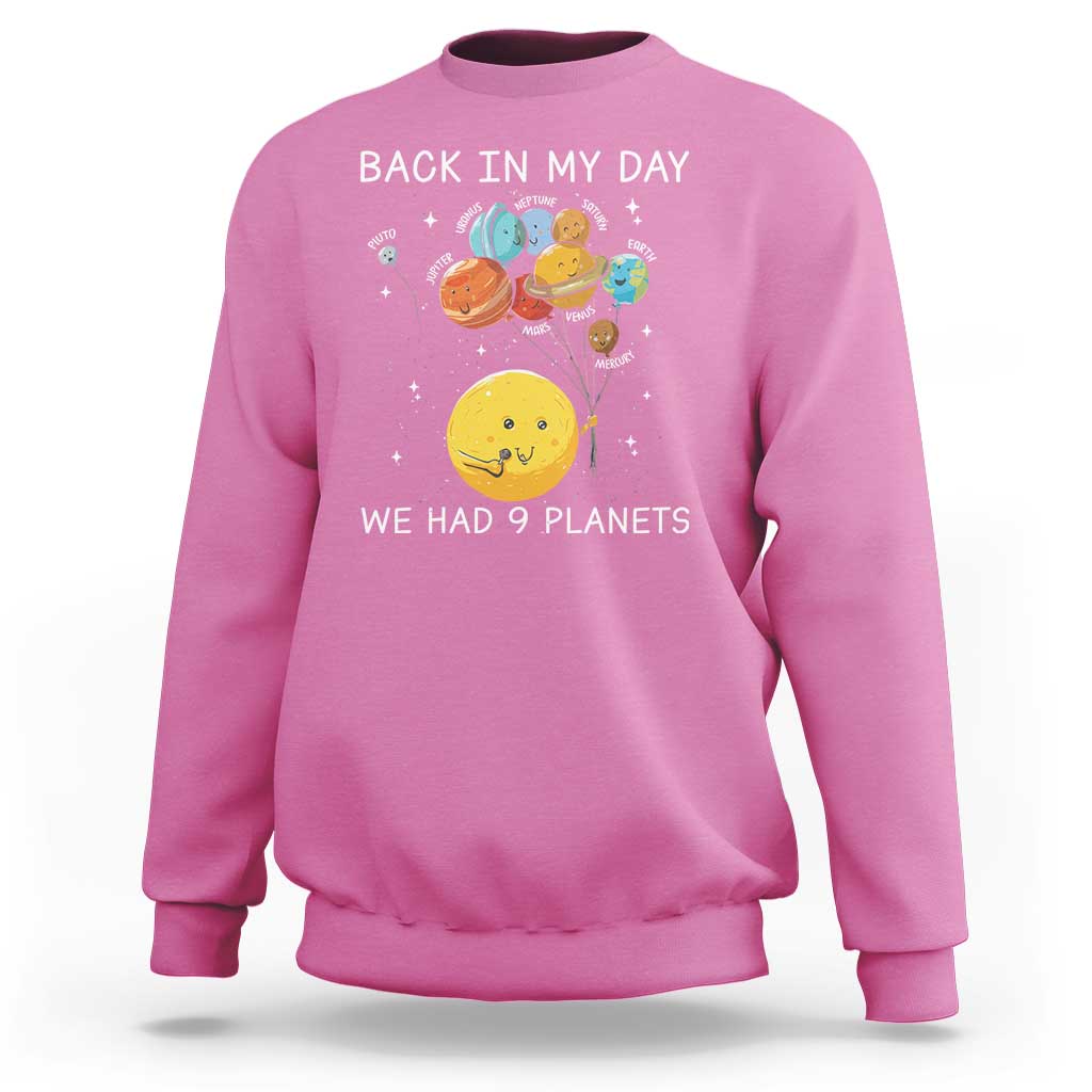 Pink crewneck sweatshirt with space planets illustration and 'Back in My Day' text.