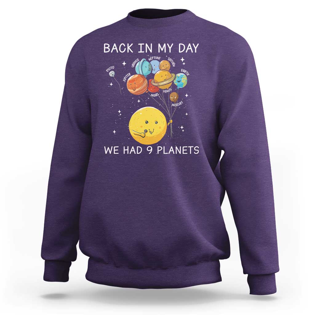 Purple crewneck sweatshirt with space planets illustration and 'Back in My Day' text.
