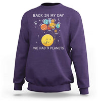 Purple crewneck sweatshirt with space planets illustration and 'Back in My Day' text.