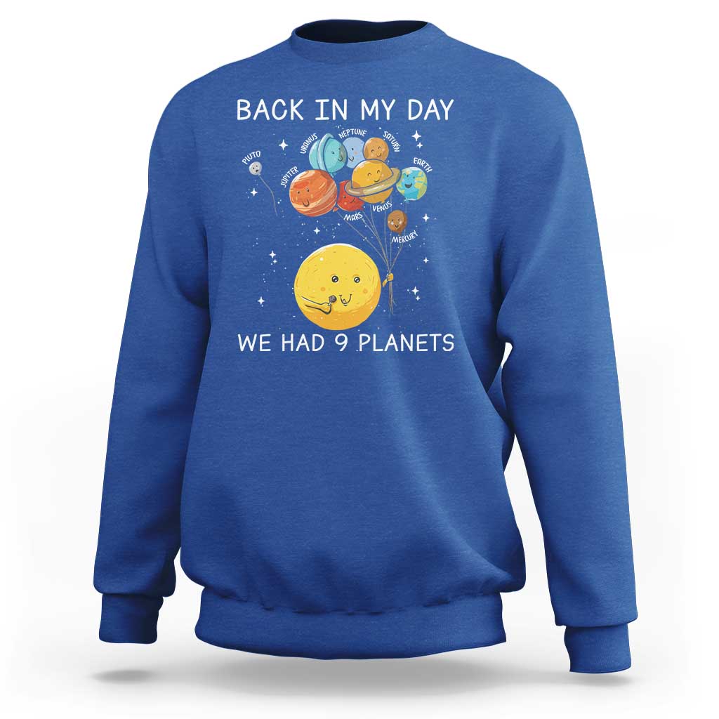 Blue crewneck sweatshirt with space planets illustration and 'Back in My Day' wording.