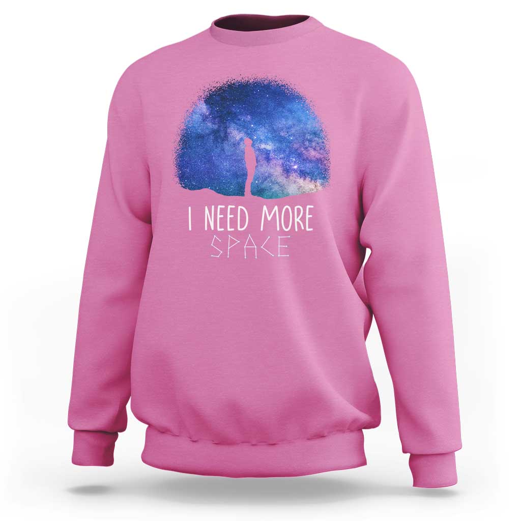 Pink astronomy sweatshirt with galaxy dome graphic, figure silhouette, 'I NEED MORE SPACE'