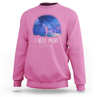 Pink astronomy sweatshirt with galaxy dome graphic, figure silhouette, 'I NEED MORE SPACE'