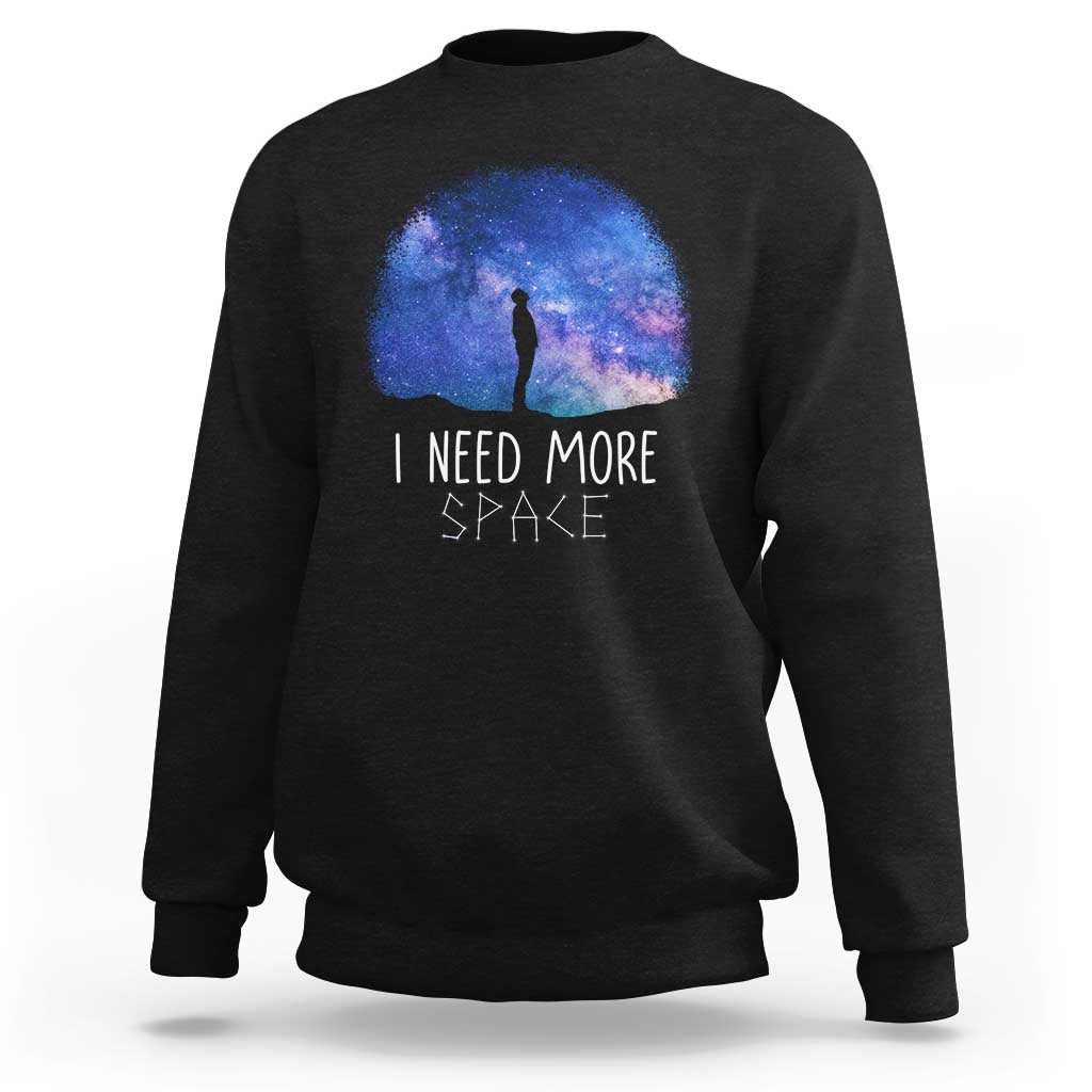 Black astronomy sweatshirt with galaxy dome graphic and 'I NEED MORE SPACE' lettering