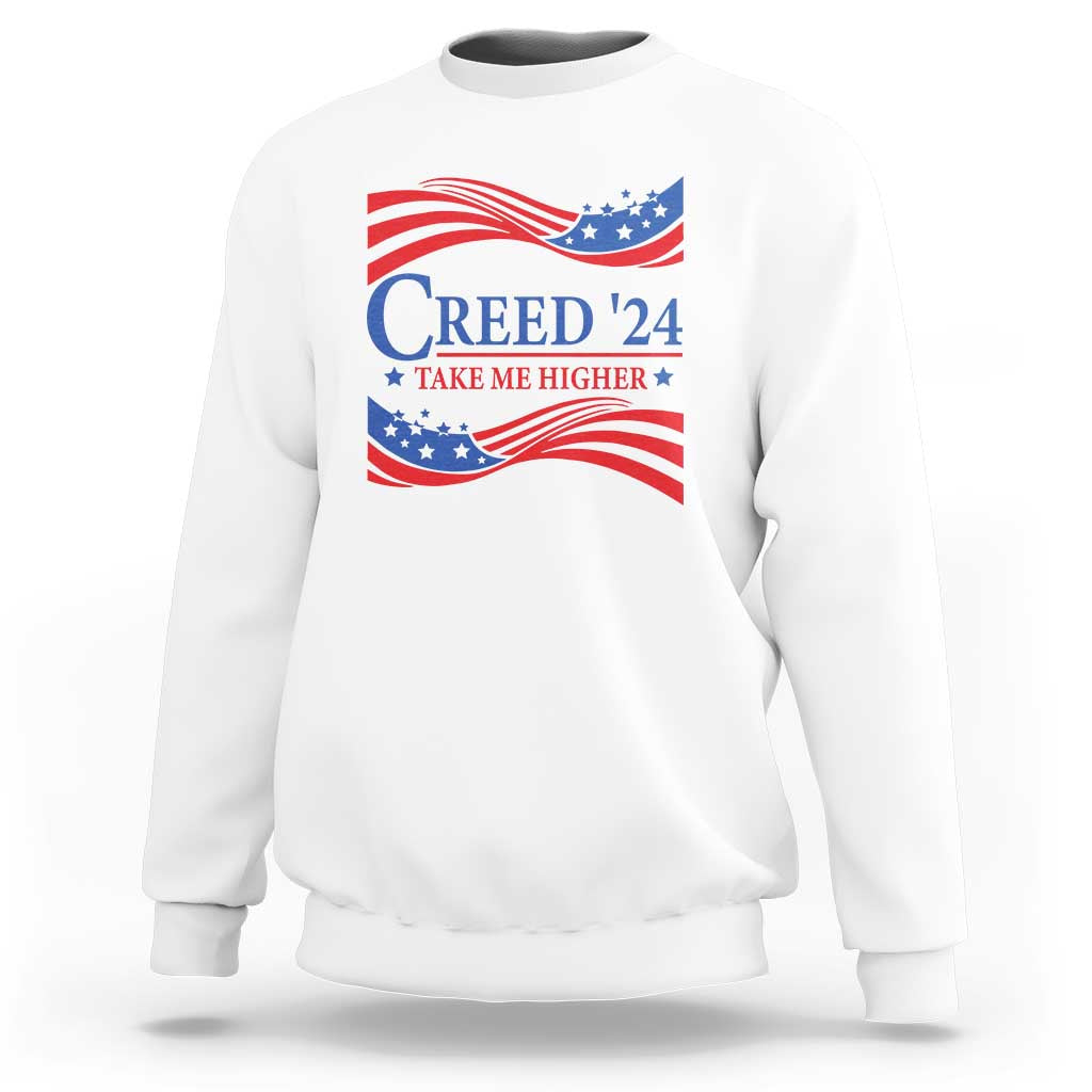 White crewneck sweatshirt with patriotic “Creed '24” graphic and wavy flag print