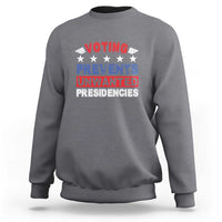 Charcoal gray graphic voting sweatshirt with “VOTING PREVENTS UNWANTED PRESIDENCIES” text