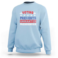 Light blue graphic voting sweatshirt with “VOTING PREVENTS UNWANTED PRESIDENCIES” text