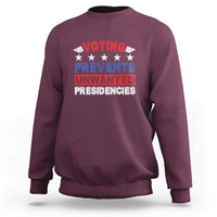 Maroon graphic voting sweatshirt with “VOTING PREVENTS UNWANTED PRESIDENCIES” text