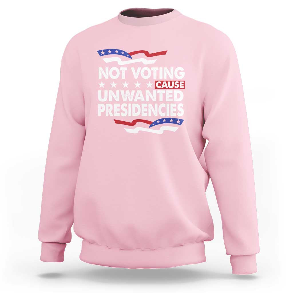 Light pink crewneck sweatshirt with 'NOT VOTING UNWANTED PRESIDENCIES' graphic