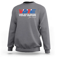 Charcoal gray crewneck sweatshirt with “VOTE” graphic and front text