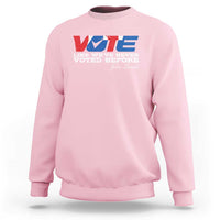 Light pink crewneck sweatshirt with “VOTE” graphic and front “Voted Before” text