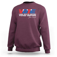 Maroon crewneck sweatshirt with “VOTE” graphic and “Voted Before” text