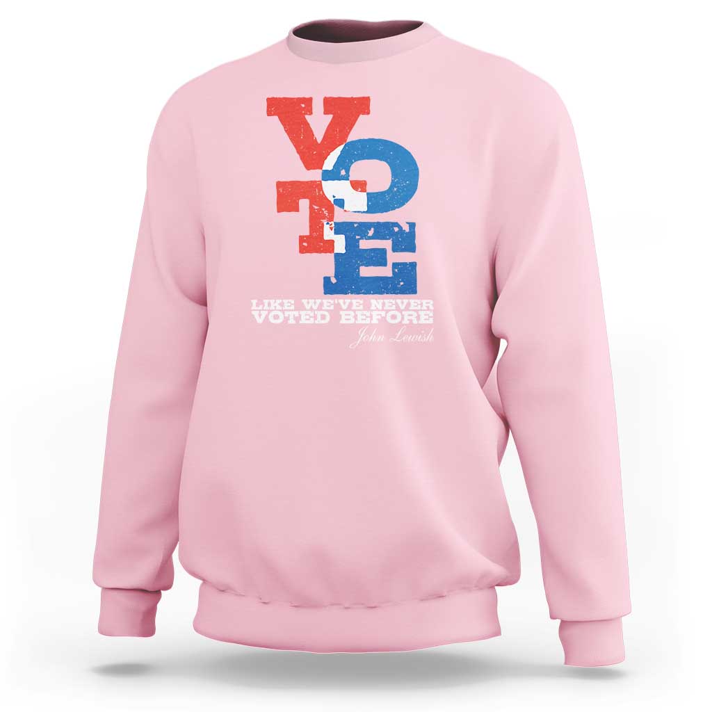 Light pink crewneck sweatshirt with "Like we've never voted before" printed graphic