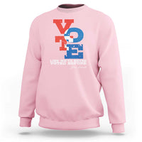 Light pink crewneck sweatshirt with "Like we've never voted before" printed graphic