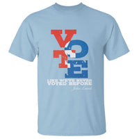 Light blue short-sleeve T-shirt with red and blue vote graphic and “Like we’ve never voted before”