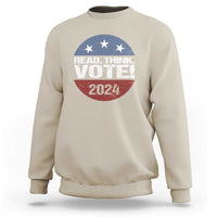 Sand-colored sweatshirt with “READ. THINK. VOTE!” stars and “2024” graphic