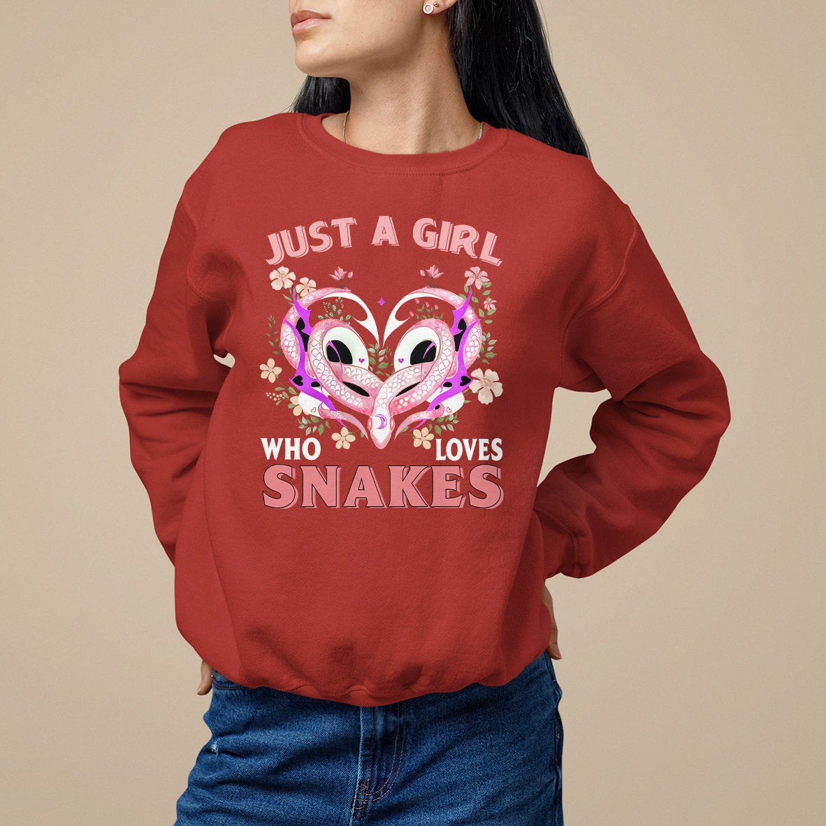 Red sweatshirt with colorful snake-heart graphic and text on front