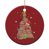 Red round ornament with capybara and nutcracker graphic, hanging gold loop