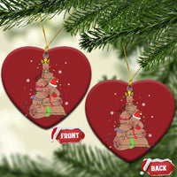Red heart ornament with capybara and nutcracker graphic, hanging gold loop, front/back tags
