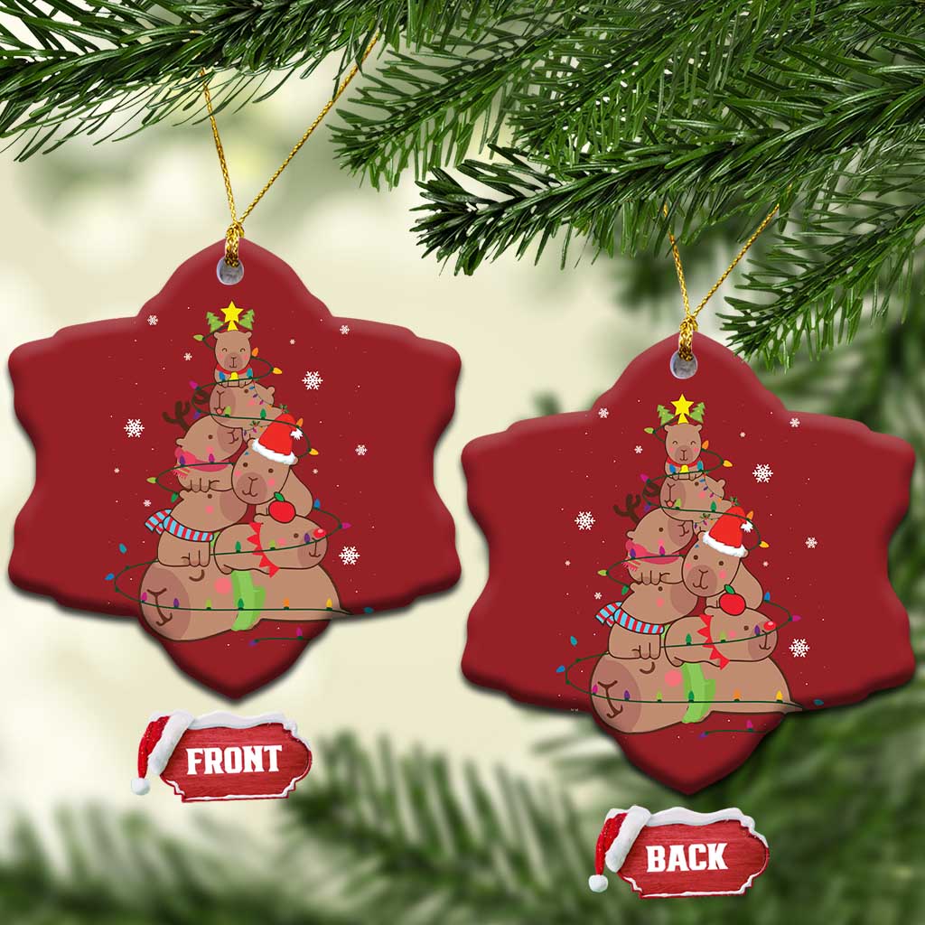 Red star ornament with capybara and nutcracker graphic, hanging gold loop, front/back tags