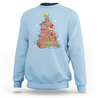 Light blue Christmas capybara tree sweatshirt with colorful holiday graphic on chest