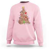 Light pink Christmas capybara tree sweatshirt with colorful holiday graphic on chest