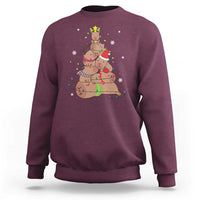 Maroon Christmas capybara tree sweatshirt with colorful holiday graphic on chest