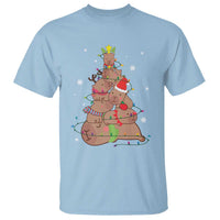 Light blue Christmas graphic T-shirt with cute capybara wearing Santa hat and winter snowflakes