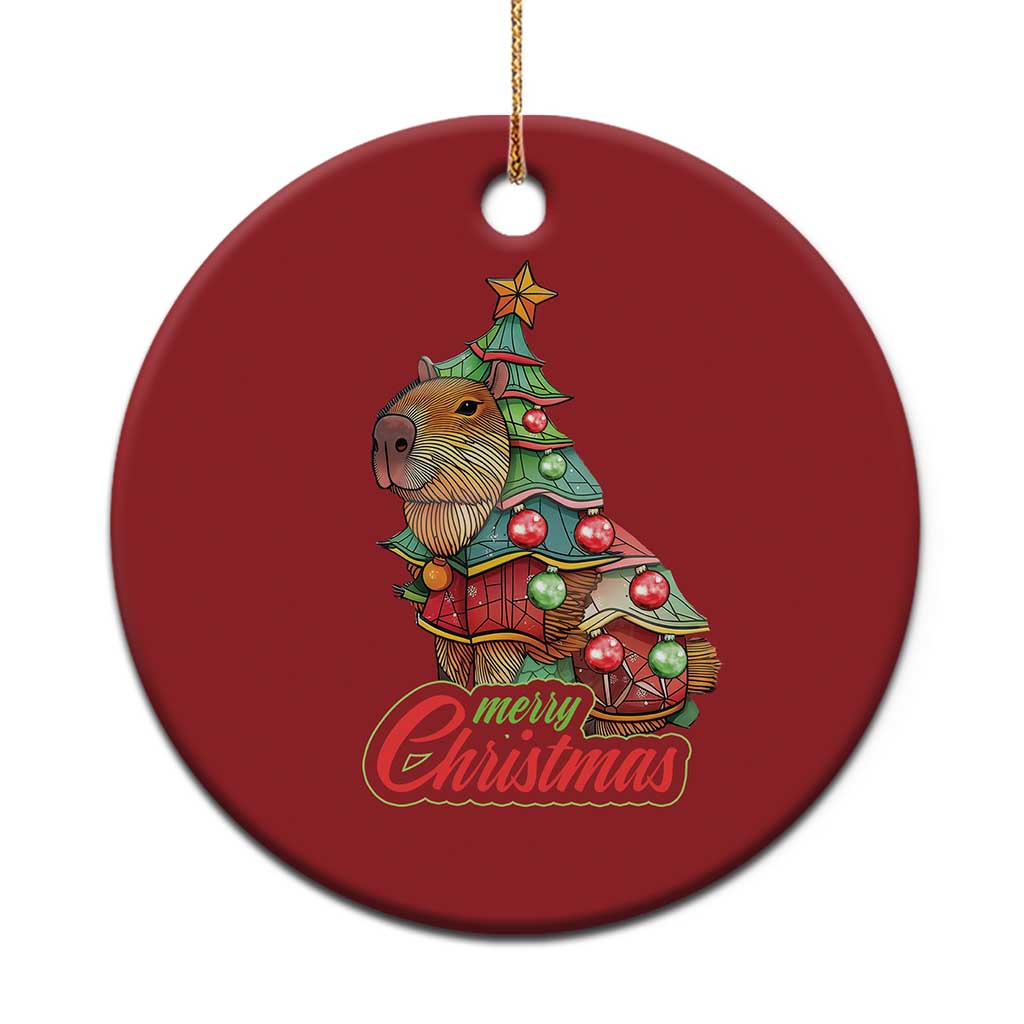 Red round capybara Christmas ornament with Merry Christmas text and gold hanging cord