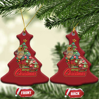Pair of red Christmas tree-shaped capybara ornaments with Merry Christmas text and gold cords
