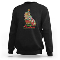 Black crewneck sweatshirt with capybara Christmas tree graphic and ribbed cuffs.