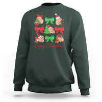 Dark forest green crewneck sweatshirt with capybara Christmas graphic and red bows