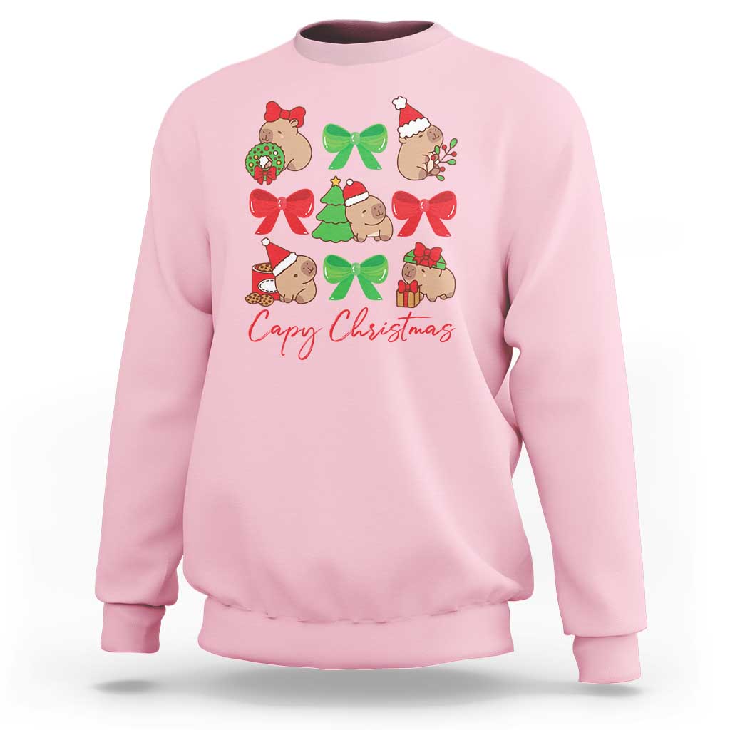 Light pink crewneck sweatshirt with capybara Christmas graphic and red bows